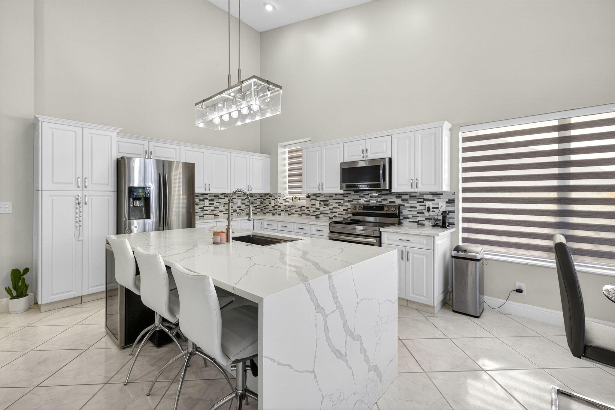 8337 Horseshoe Bay Road Boynton Beach, FL 33472 - Photo 15 of 55 a kitchen with refrigerator and cabinets