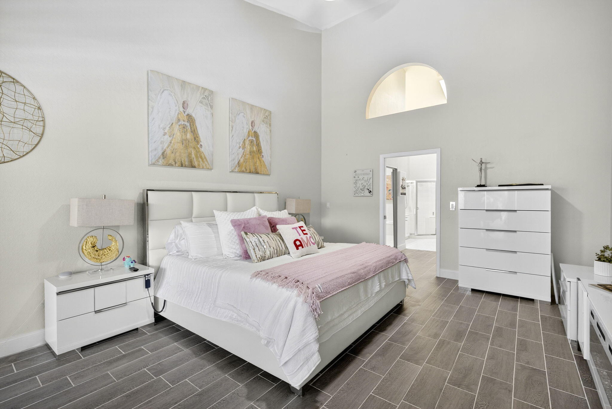 8337 Horseshoe Bay Road Boynton Beach, FL 33472 - Photo 21 of 55 a bedroom with a bed and a chandelier