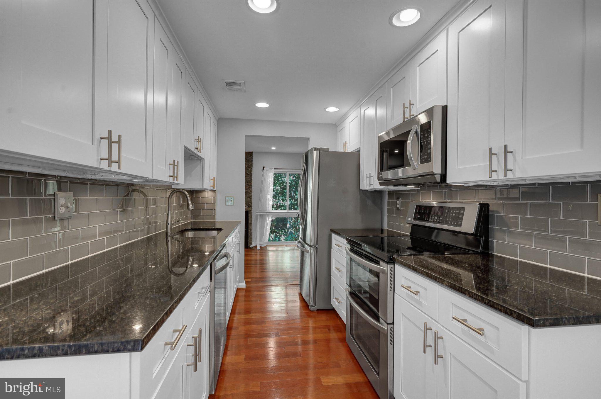 2382 Generation Drive Reston, VA 20191 - Photo 9 of 49 Modern kitchen with sleek finishes.