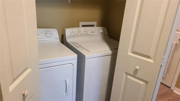 a view of room with wooden floor