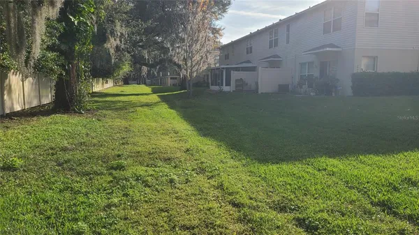 a view of outdoor space with garden and trees