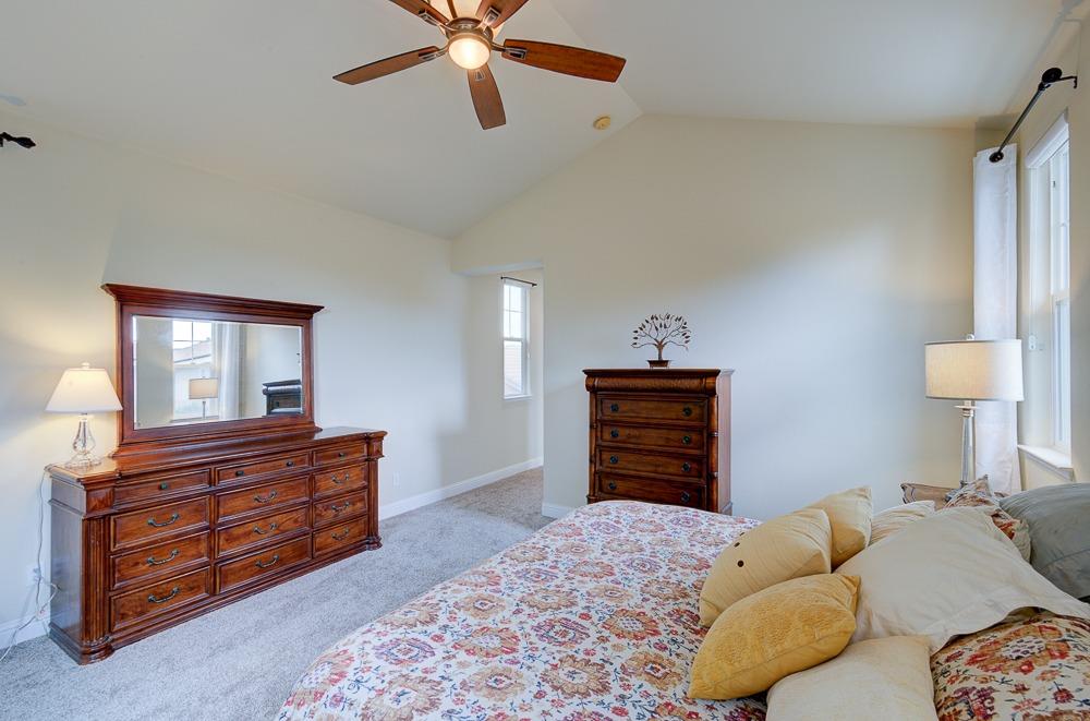 3852 Harlan Ranch Boulevard Clovis, CA 93619 - Photo 22 of 45 a bedroom with a bed and a dresser