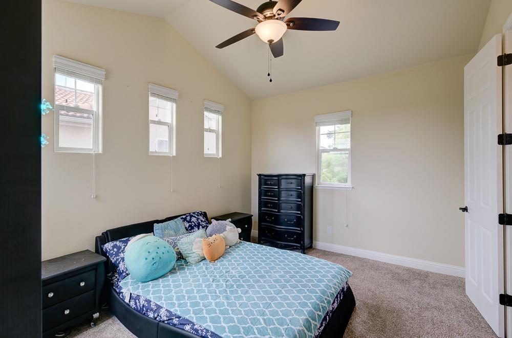 3852 Harlan Ranch Boulevard Clovis, CA 93619 - Photo 30 of 45 a bedroom with a bed and window