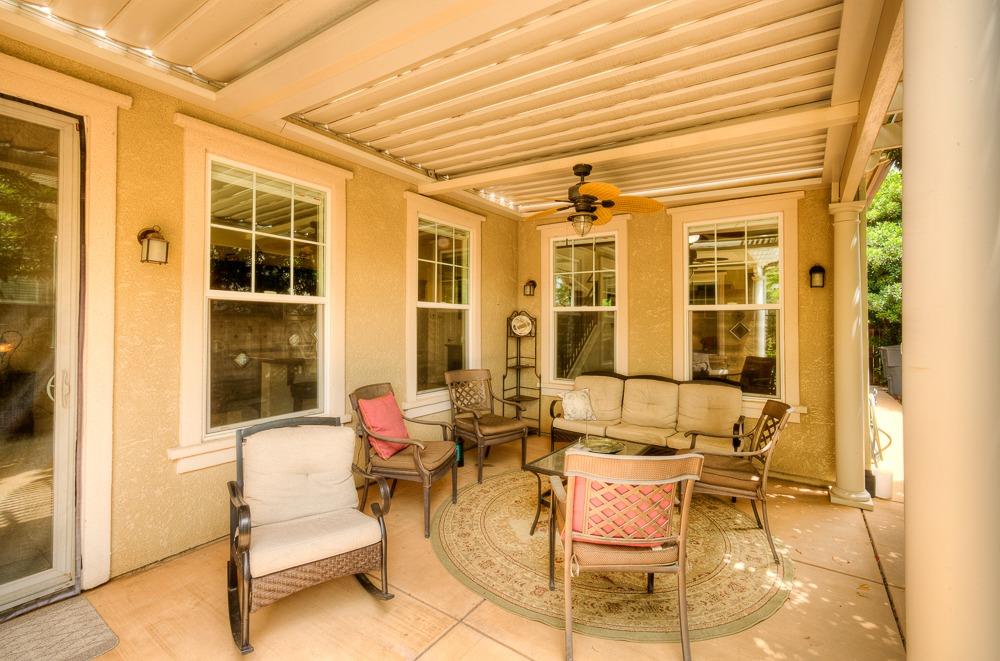 3852 Harlan Ranch Boulevard Clovis, CA 93619 - Photo 33 of 45 a patio with patio and glass windows