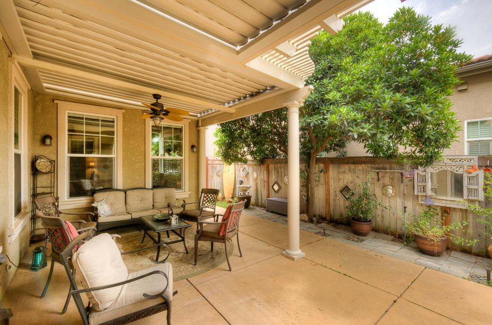3852 Harlan Ranch Boulevard Clovis, CA 93619 - Photo 35 of 45 a view of a patio with table and chairs and potted plants