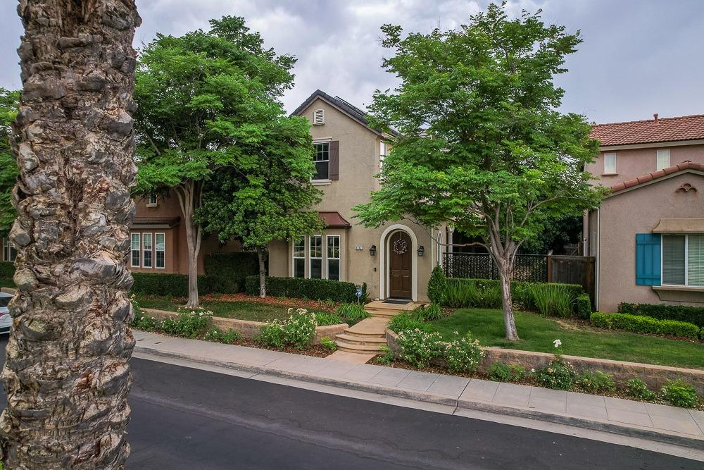 3852 Harlan Ranch Boulevard Clovis, CA 93619 - Photo 45 of 45 a front view of a house with a yard and a garage