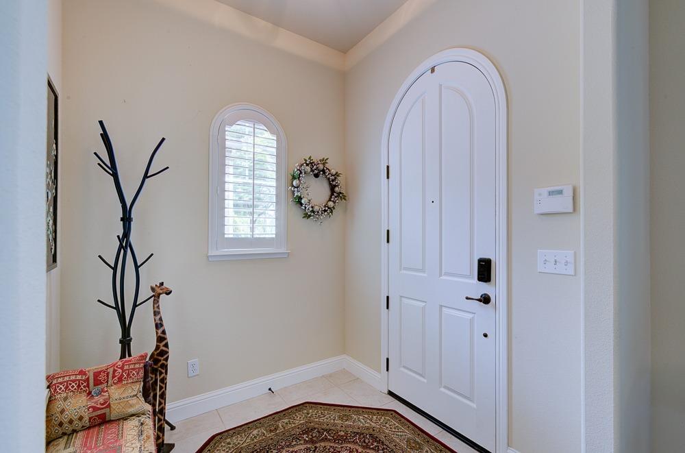 3852 Harlan Ranch Boulevard Clovis, CA 93619 - Photo 6 of 45 a view of an entryway with wooden floor