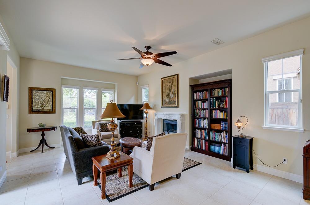 3852 Harlan Ranch Boulevard Clovis, CA 93619 - Photo 8 of 45 a living room with furniture a flat screen tv and a window