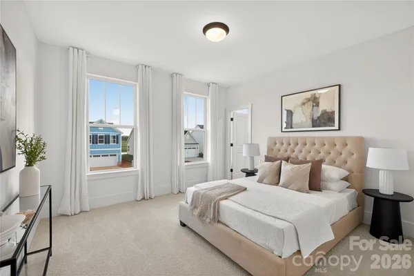 a bedroom with a bed and a table
