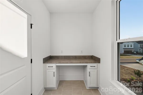 a utility room with cabinets