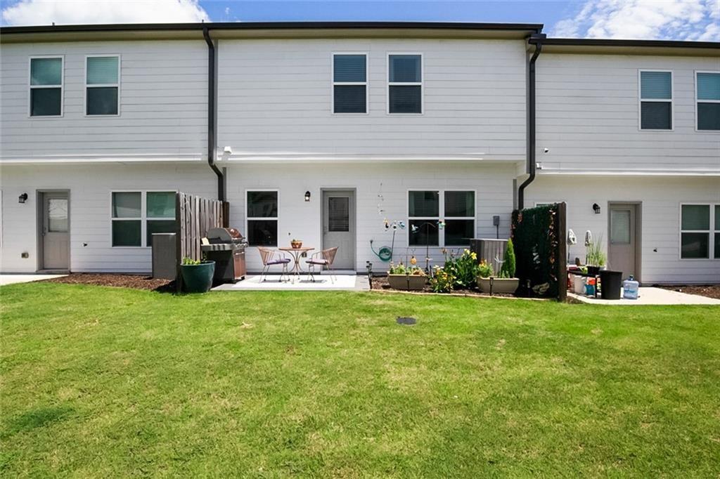 1484 Ben Park Way Grayson, GA 30017 - Photo 14 of 14 a view of a house with backyard and porch