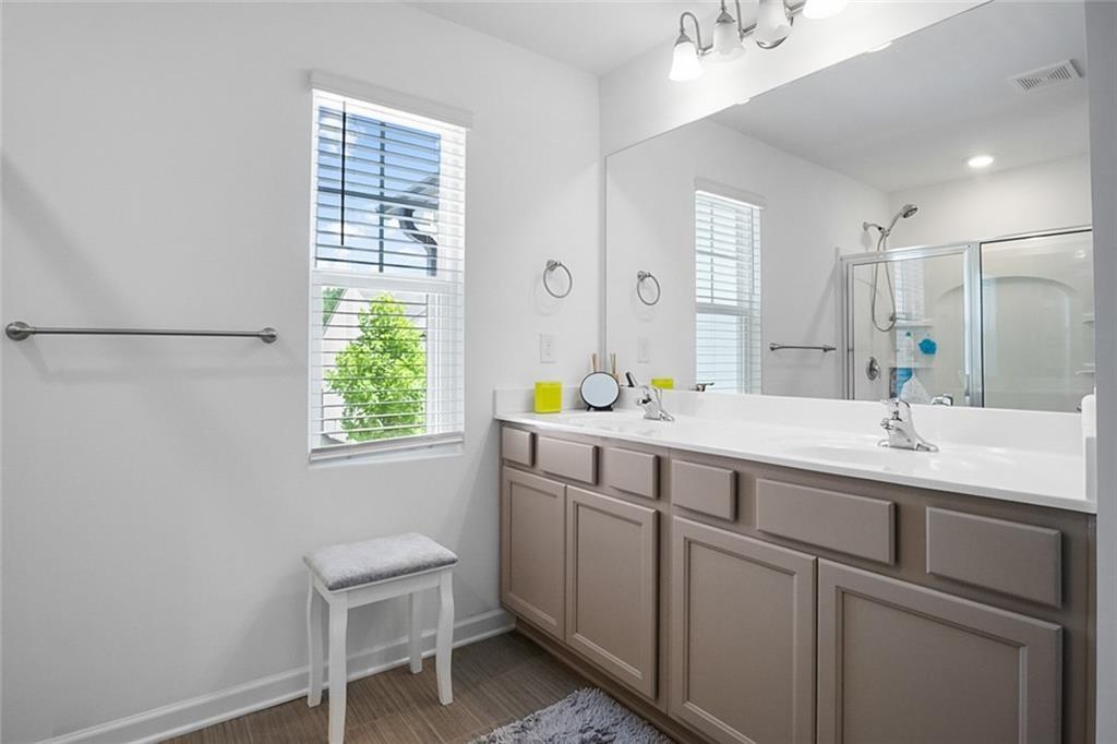1484 Ben Park Way Grayson, GA 30017 - Photo 10 of 14 a bathroom with a sink and a mirror