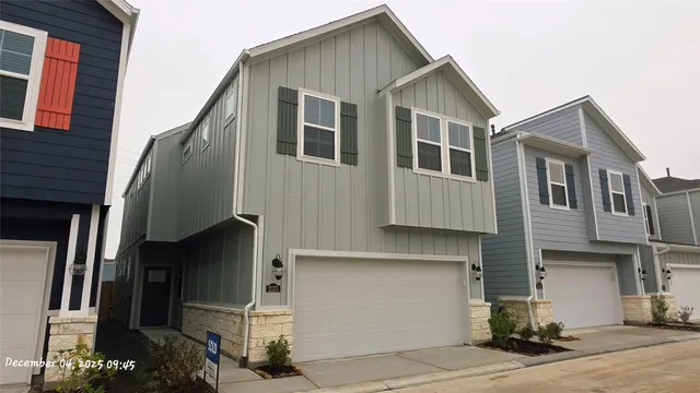a front view of a house with a garage
