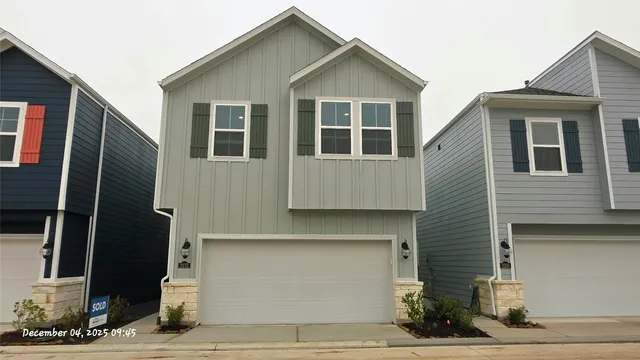 a front view of a house with garage