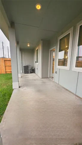 a view of an empty room with a kitchen