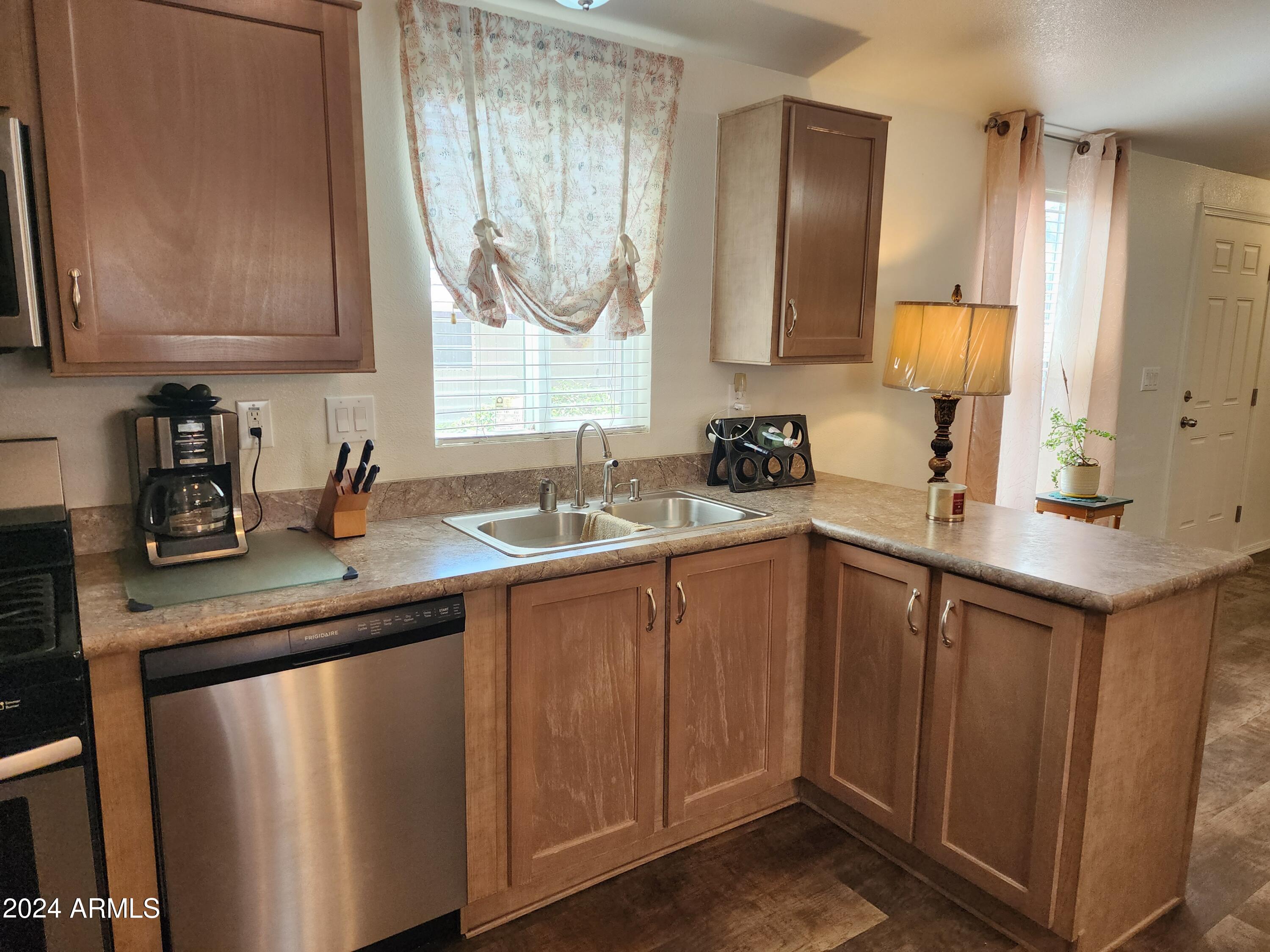 16005 North 32nd Street, Unit 31 Phoenix, AZ 85032 - Photo 16 of 48 a bathroom with a double vanity sink and a mirror