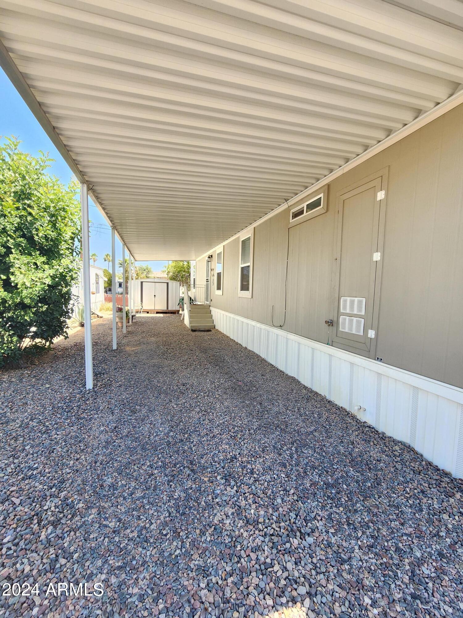 16005 North 32nd Street, Unit 31 Phoenix, AZ 85032 - Photo 2 of 48 a view of an empty room with wooden floor