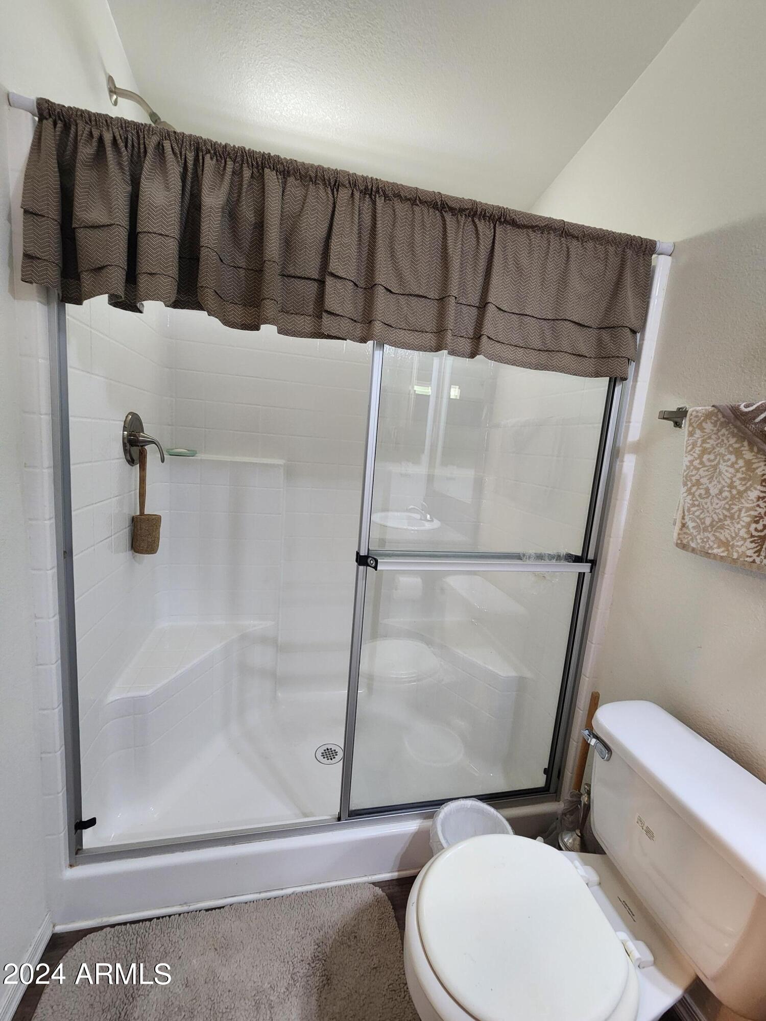 16005 North 32nd Street, Unit 31 Phoenix, AZ 85032 - Photo 23 of 48 a bathroom with a toilet and a shower