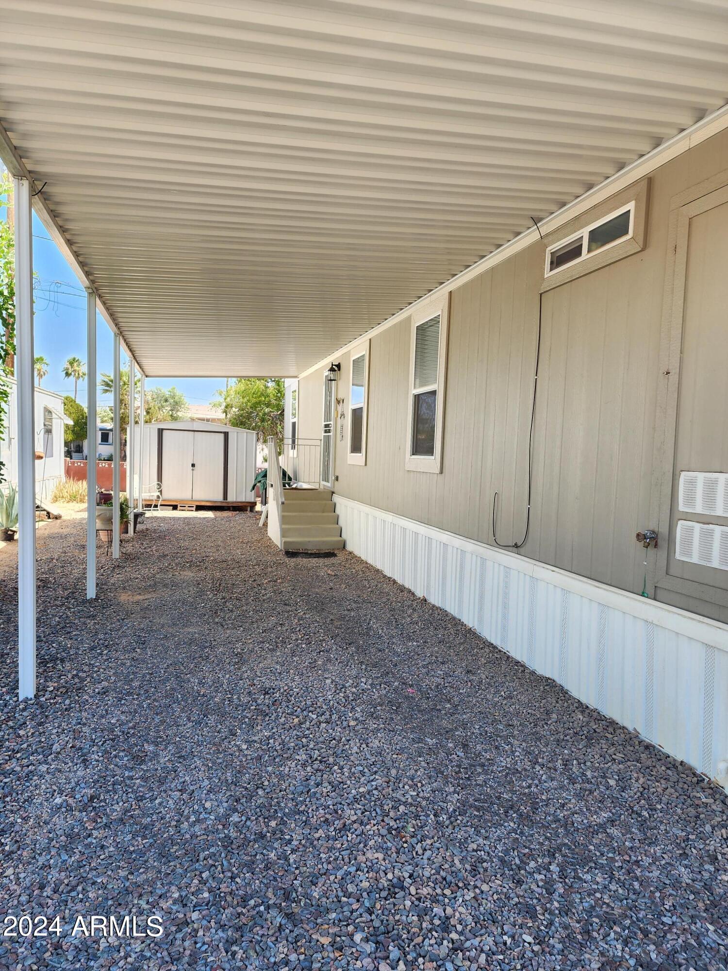 16005 North 32nd Street, Unit 31 Phoenix, AZ 85032 - Photo 30 of 48 a view of a house with a backyard