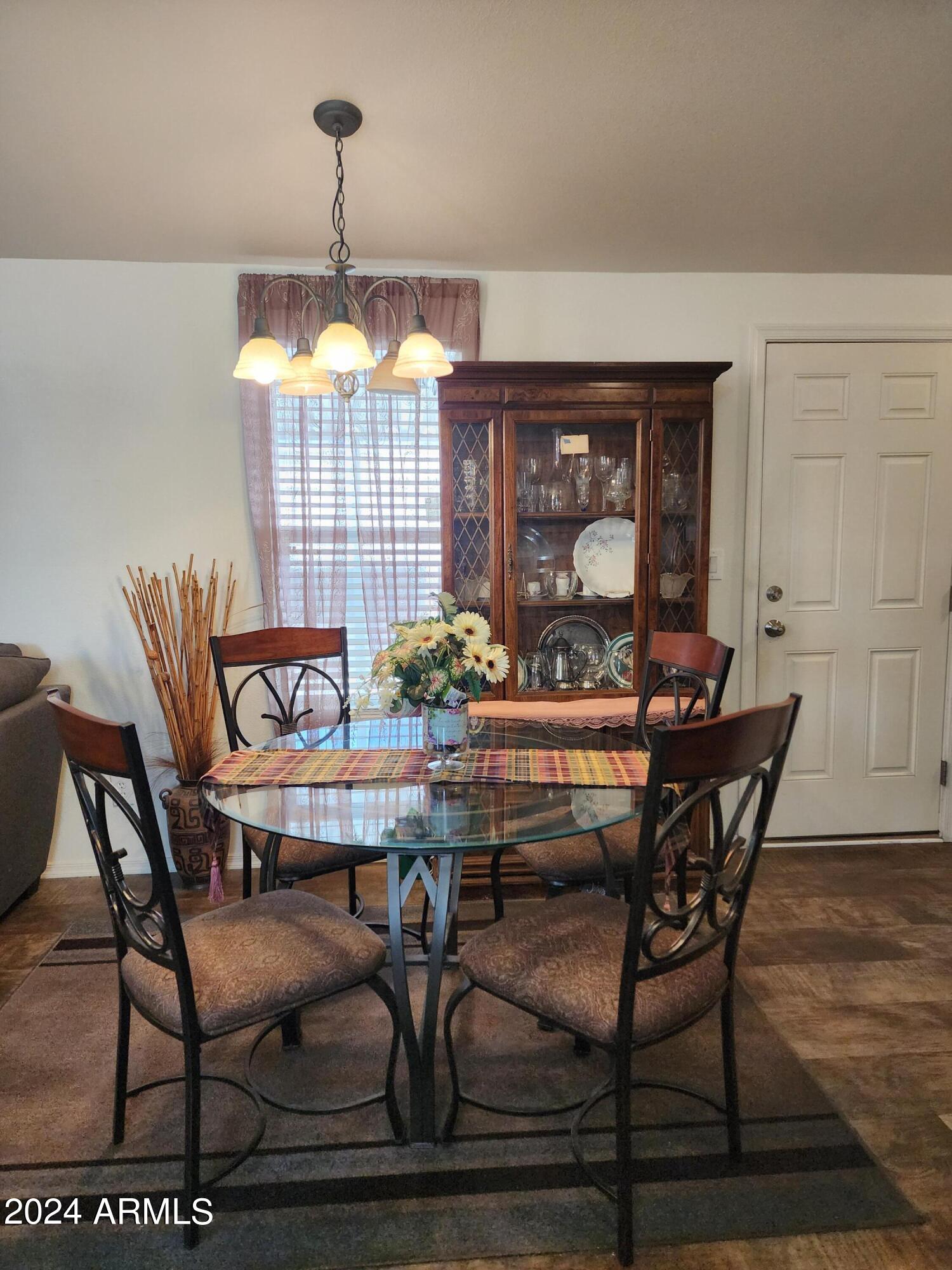 16005 North 32nd Street, Unit 31 Phoenix, AZ 85032 - Photo 3 of 48 a dining room table with chairs and window