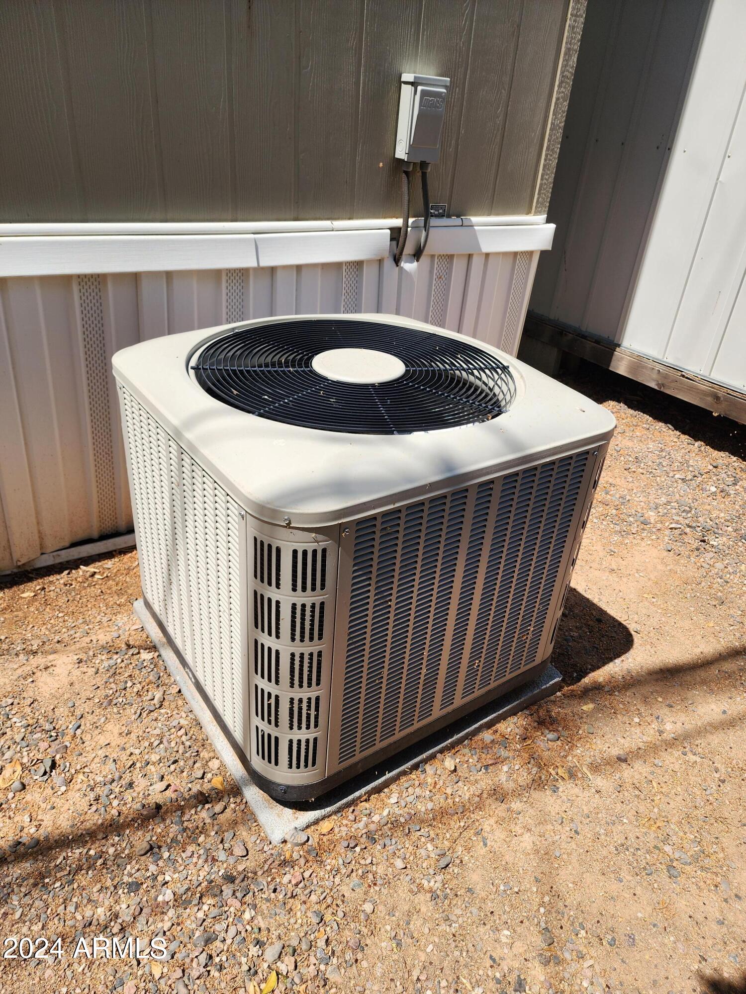 16005 North 32nd Street, Unit 31 Phoenix, AZ 85032 - Photo 32 of 48 a room with a wooden floor and shelf