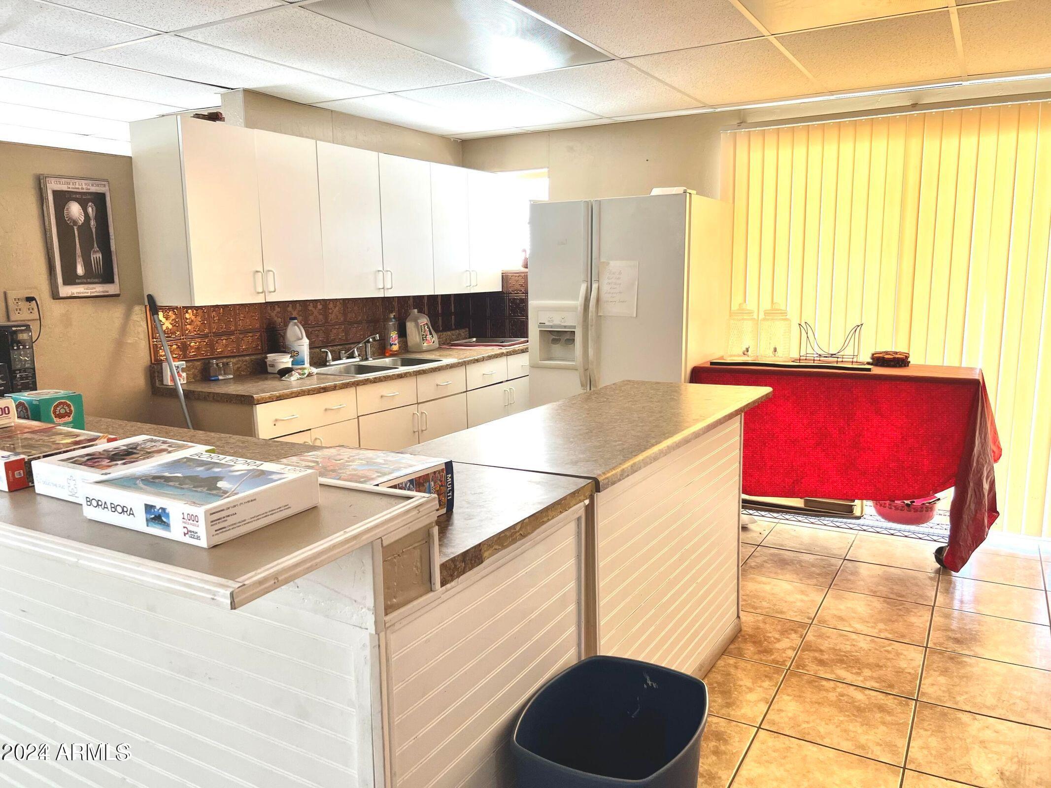 16005 North 32nd Street, Unit 31 Phoenix, AZ 85032 - Photo 43 of 48 a kitchen with stainless steel appliances granite countertop a stove a sink and a microwave