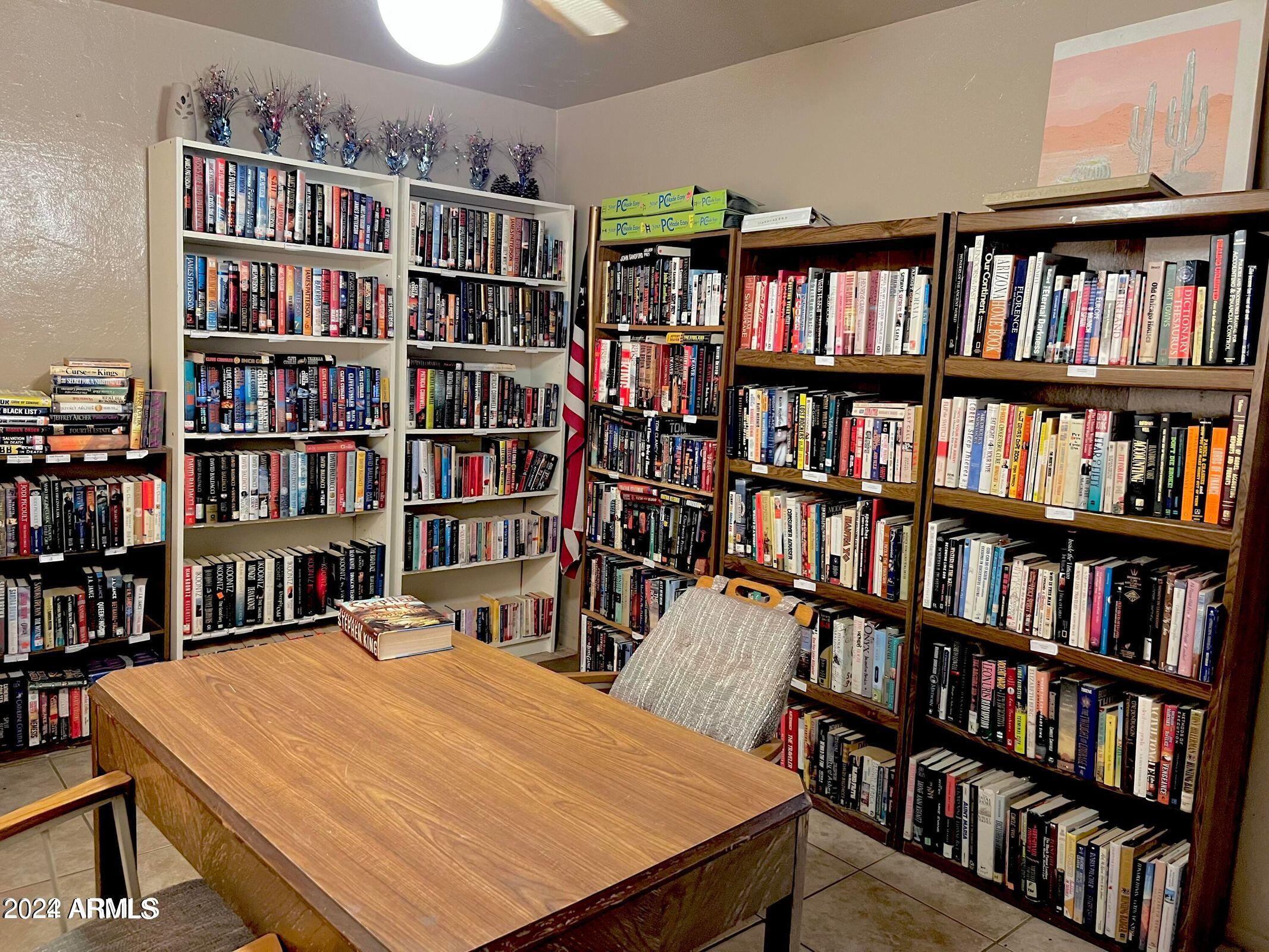 16005 North 32nd Street, Unit 31 Phoenix, AZ 85032 - Photo 44 of 48 a room with bookshelf and a bookshelf