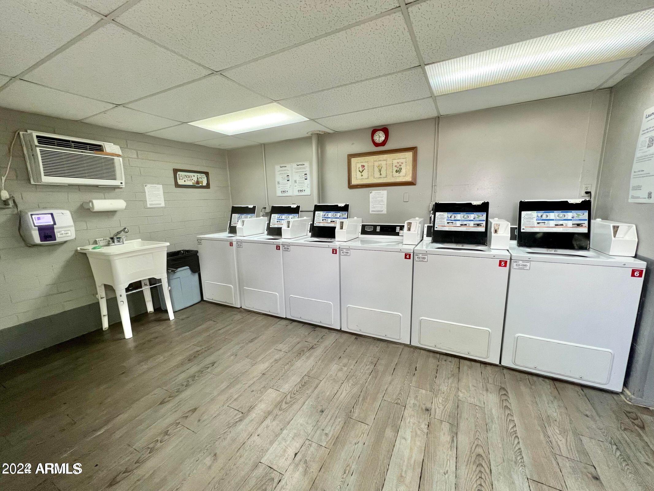 16005 North 32nd Street, Unit 31 Phoenix, AZ 85032 - Photo 48 of 48 a room with furniture a dining table wooden floor and a fireplace