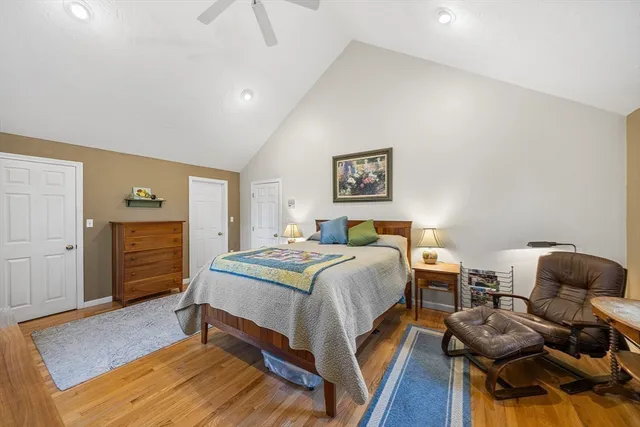 a bathroom with a granite countertop sink toilet a mirror a vanity and shower