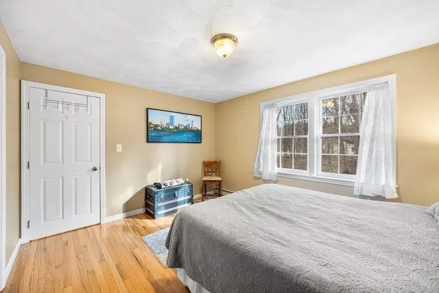 a bedroom with a bed and painted walls