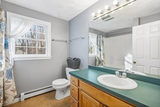 a view of a house with a backyard and deck