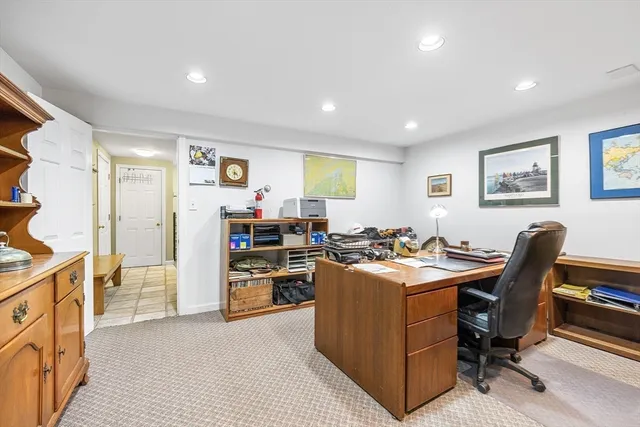 a view of a house with a yard and trees