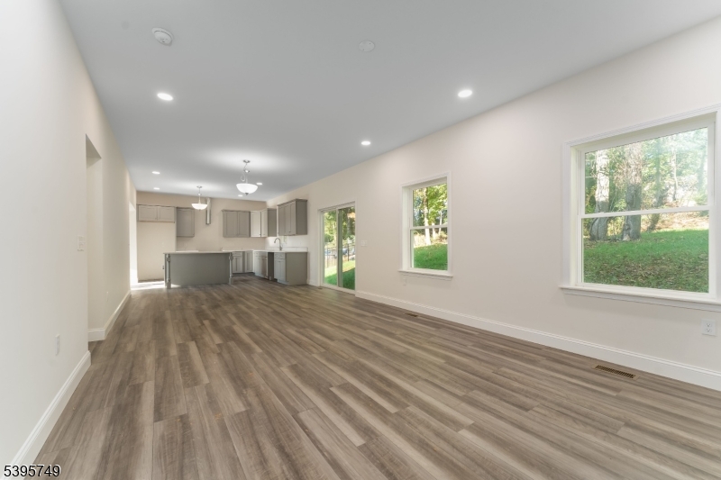 9 Heather Hill Road Washington, NJ 07882 - Photo 15 of 29 a view of empty room with wooden floor and fan