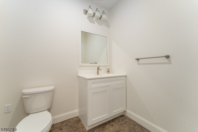 9 Heather Hill Road Washington, NJ 07882 - Photo 19 of 29 a bathroom with a toilet sink and mirror