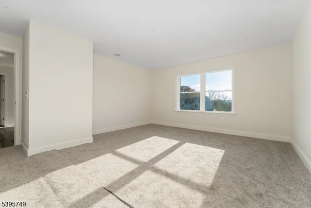 a spacious bedroom with a bed and a couch