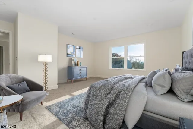 a bathroom with a toilet sink and window