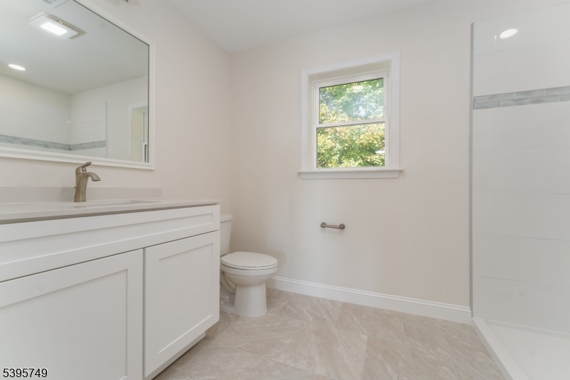 9 Heather Hill Road Washington, NJ 07882 - Photo 22 of 29 a bathroom with a toilet sink and window