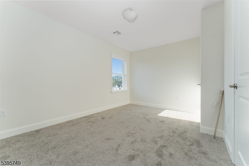 9 Heather Hill Road Washington, NJ 07882 - Photo 26 of 29 an empty room with a empty space and windows