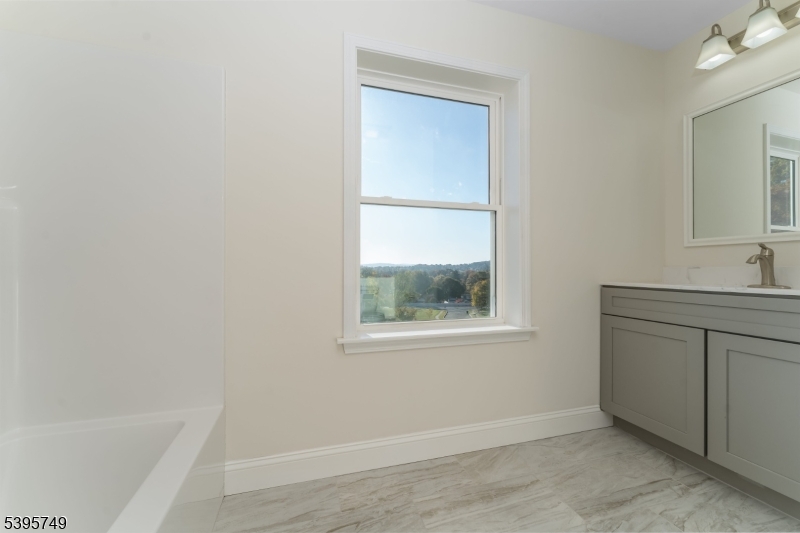9 Heather Hill Road Washington, NJ 07882 - Photo 28 of 29 a bathroom with a sink and a bathtub