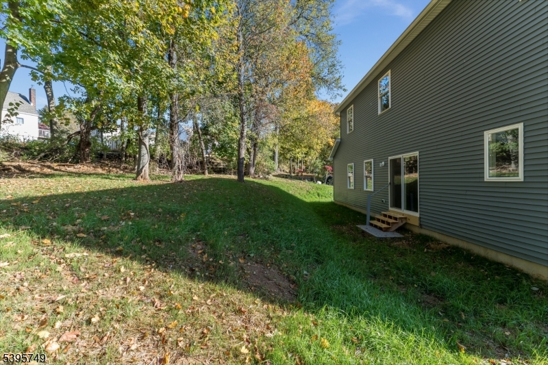 9 Heather Hill Road Washington, NJ 07882 - Photo 4 of 29 a view of a backyard with large trees