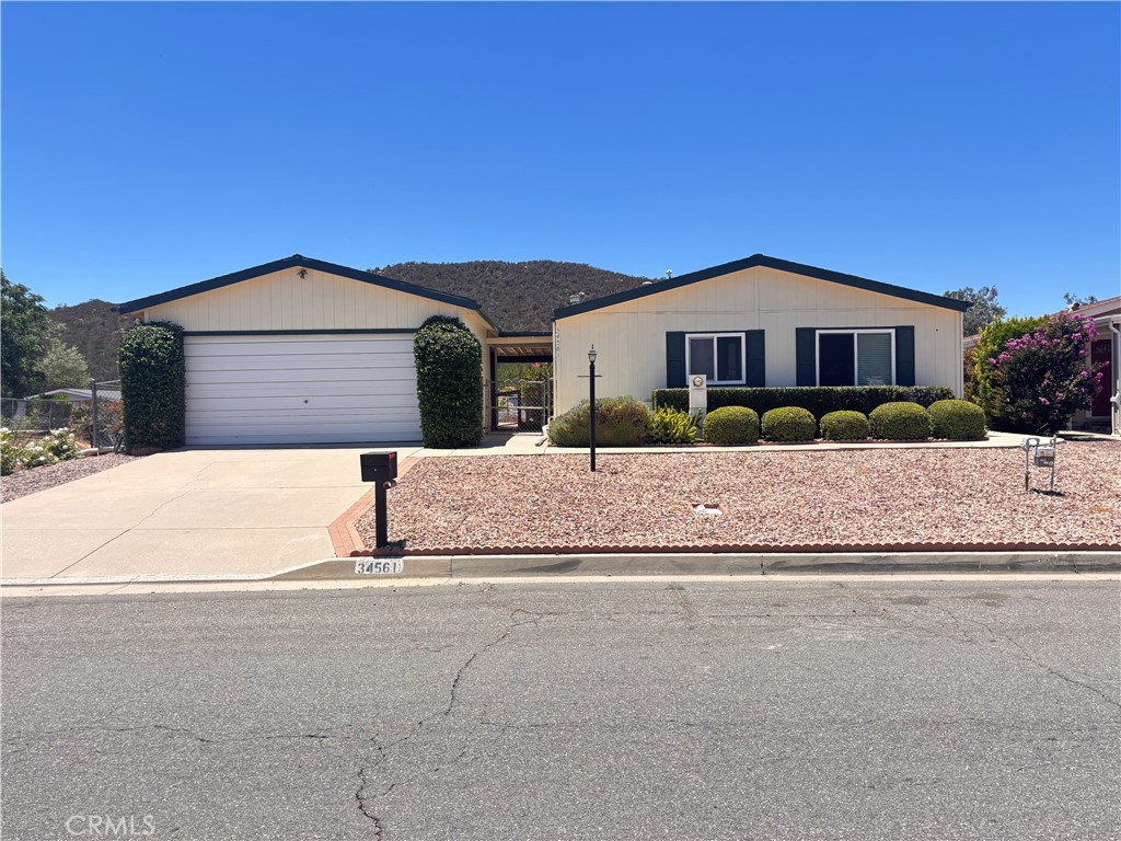 34561 The Farm Road Wildomar, CA 92595 - Photo 2 of 36 a front view of a house with a yard