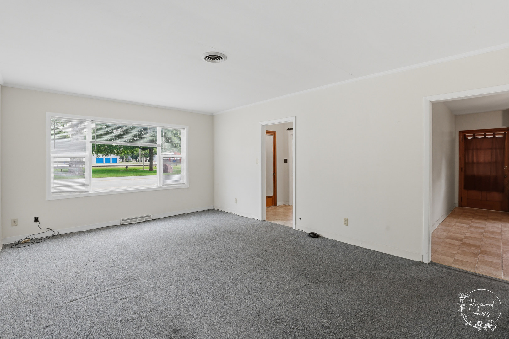 409 Main Street Crescent City, IL 60928 - Photo 4 of 22 a view of an empty room with a window