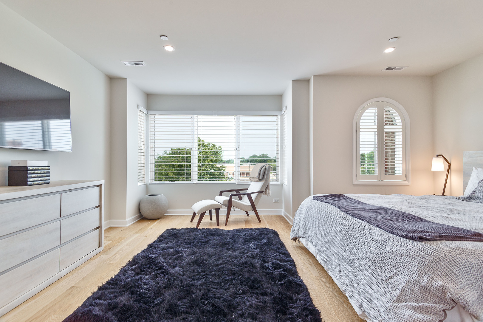 1263 Shermer Road Northbrook, IL 60062 - Photo 18 of 33 a spacious bedroom with a large bed and a large window