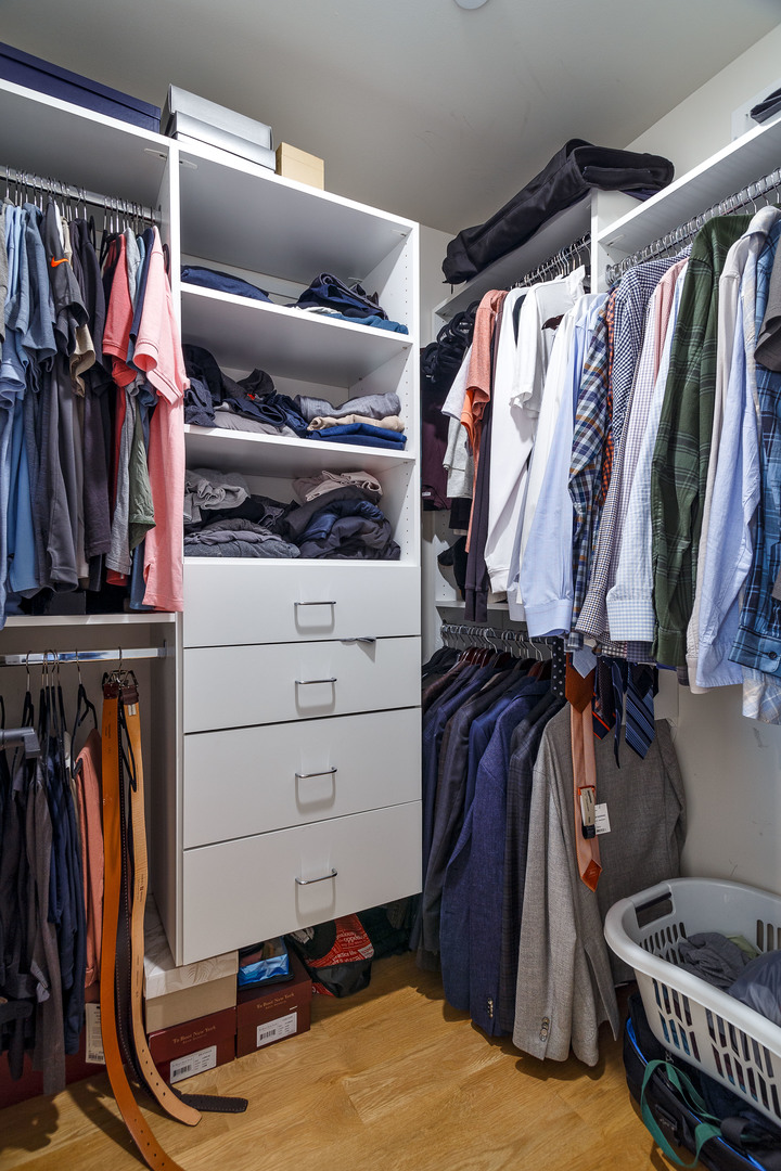 1263 Shermer Road Northbrook, IL 60062 - Photo 19 of 33 a view of walk in closet with clothes and shoes