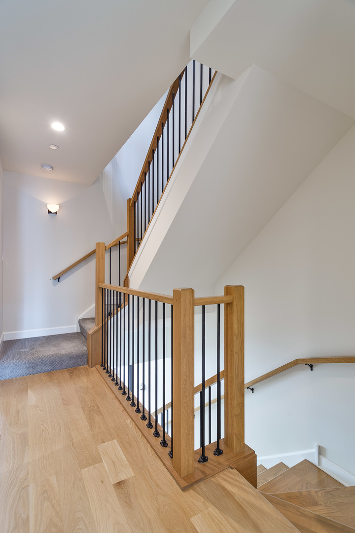 1263 Shermer Road Northbrook, IL 60062 - Photo 25 of 33 a view of staircase with white floor and a chandelier