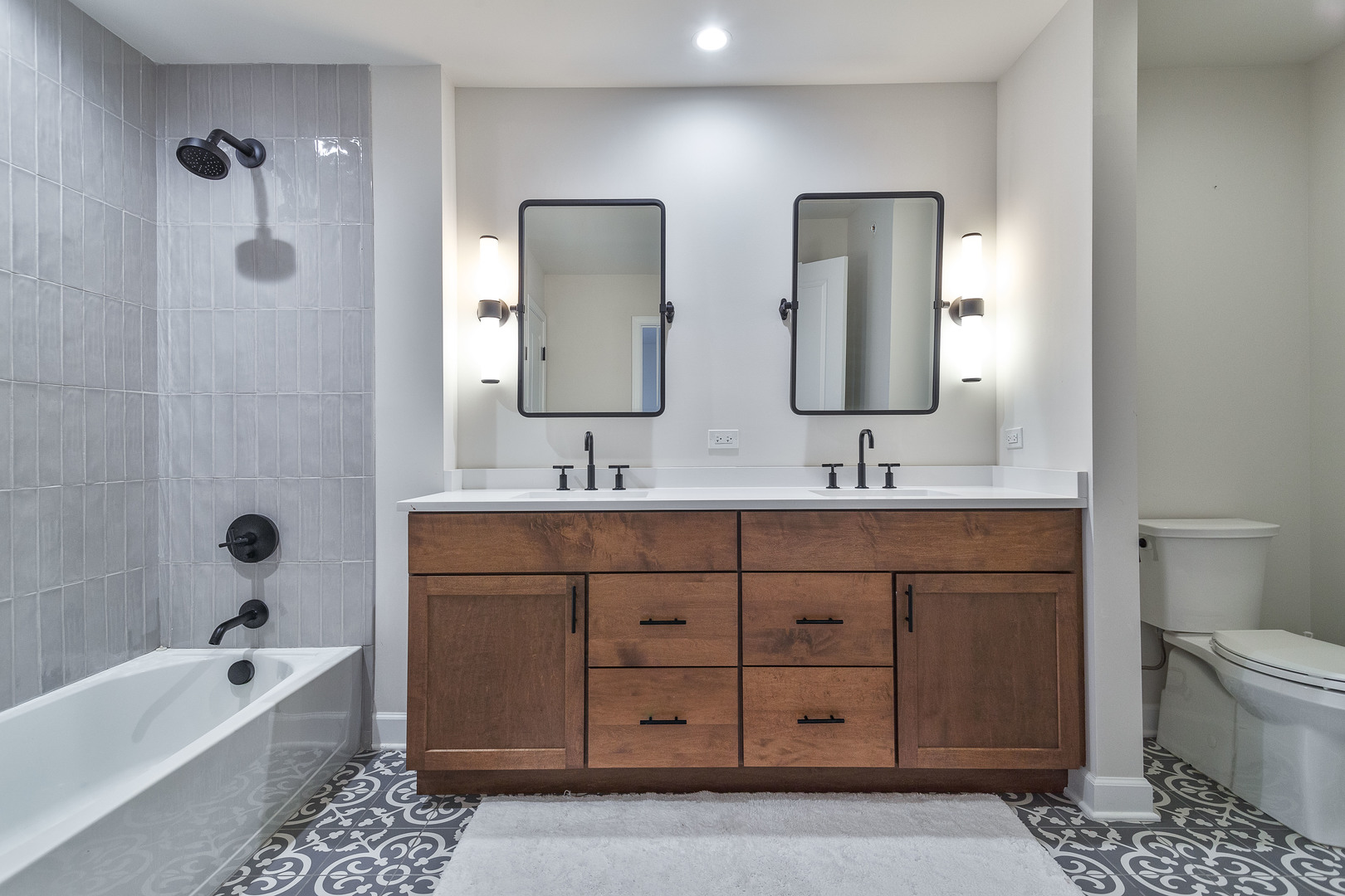 1263 Shermer Road Northbrook, IL 60062 - Photo 28 of 33 a bathroom with a double vanity sink mirror double and bathtub