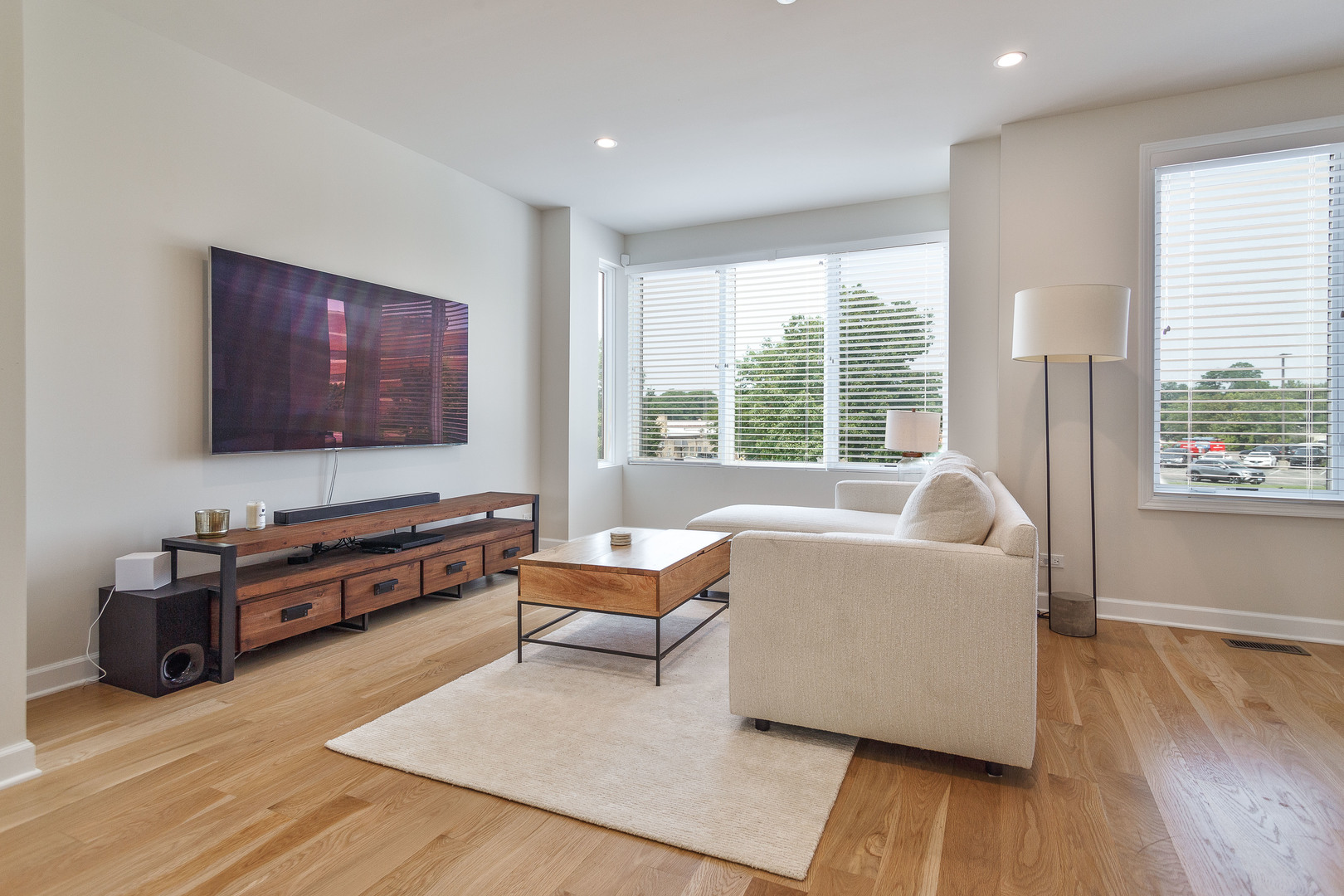 1263 Shermer Road Northbrook, IL 60062 - Photo 3 of 33 a living room with furniture and a flat screen tv