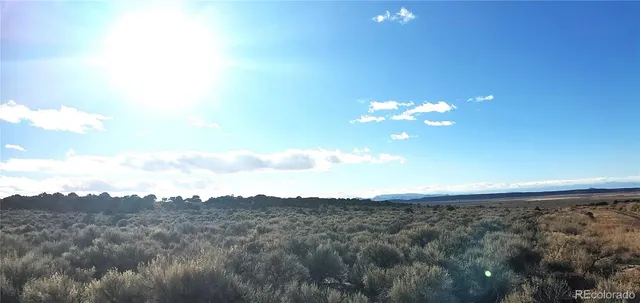a view of a chandelier fan and a fire place