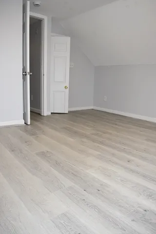 a view of a room with wooden walls