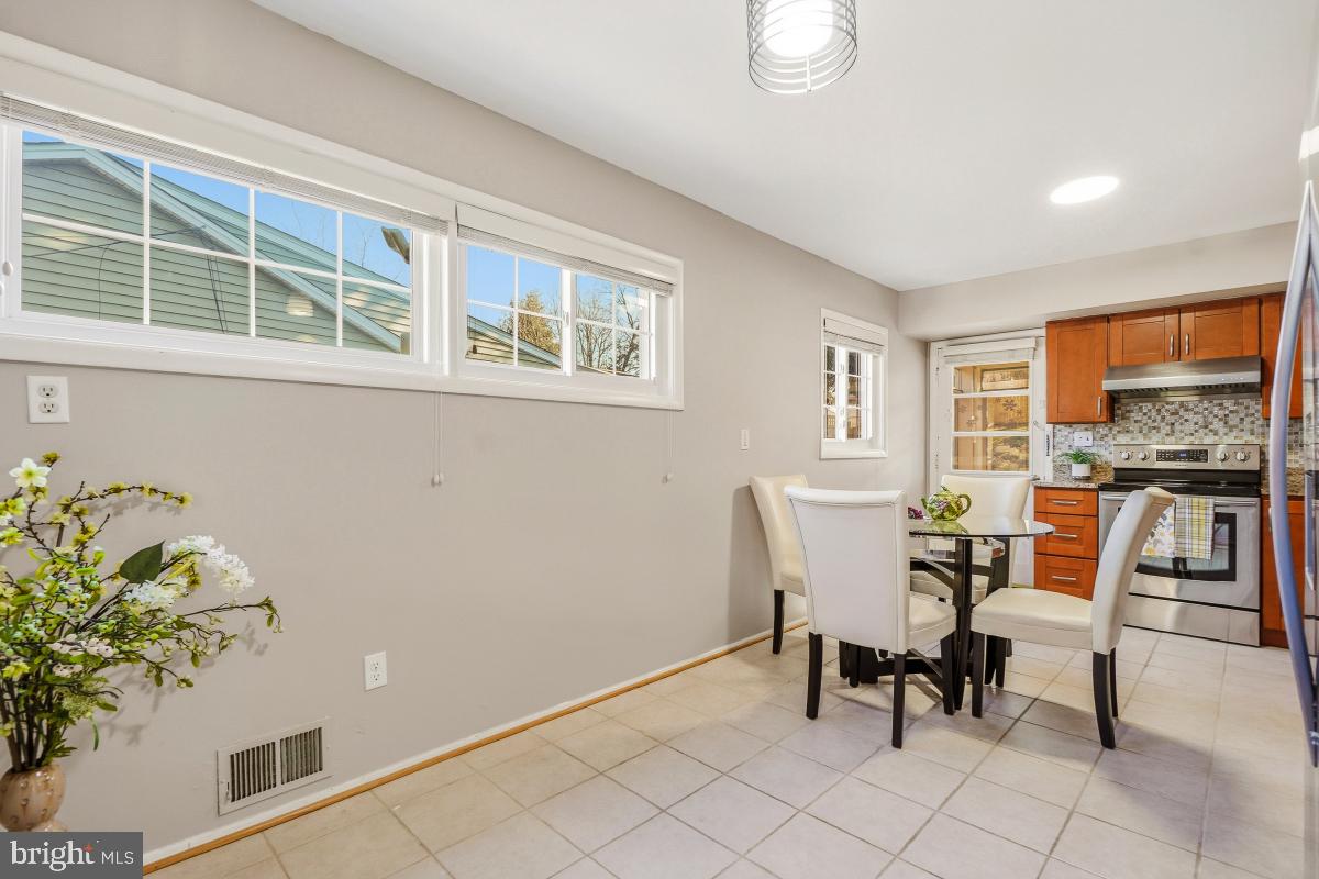 1021 Brice Road Rockville, MD 20852 - Photo 11 of 44 a dining room with furniture and window